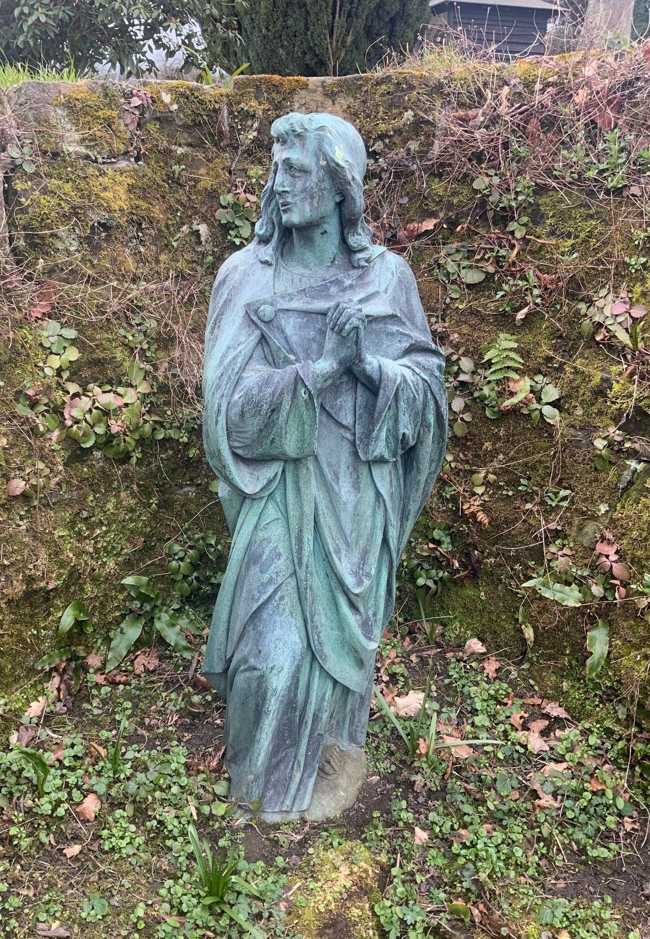 A Victorian green patinated cast iron statue of a saint in prayer, height 92cm. Condition - poor to fair